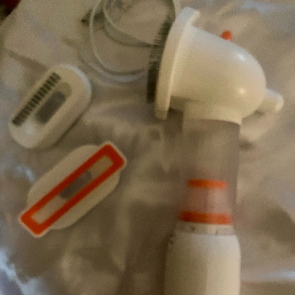NEW, in box, (never used) a pet (dog or cat) vacuum. Get rid of that pesky hair!